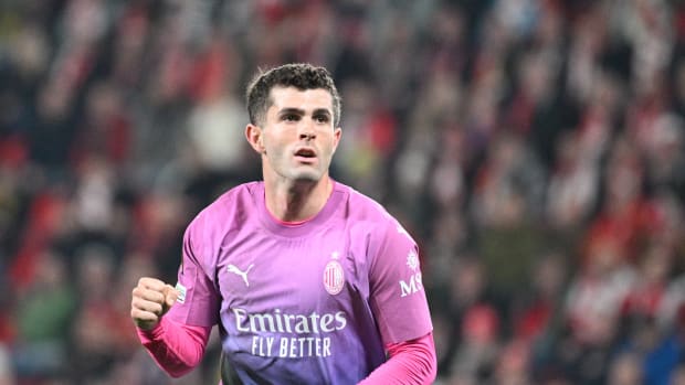Christian Pulisic pictured celebrating after scoring for AC Milan in a 3-1 win away at Slavia Prague in the UEFA Europa League in March 2024